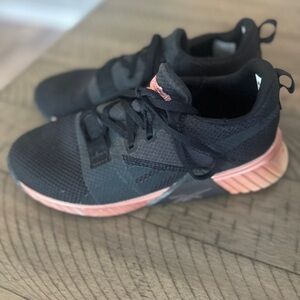 Used and well worn women’s Reebok training sneakers, size 6.5